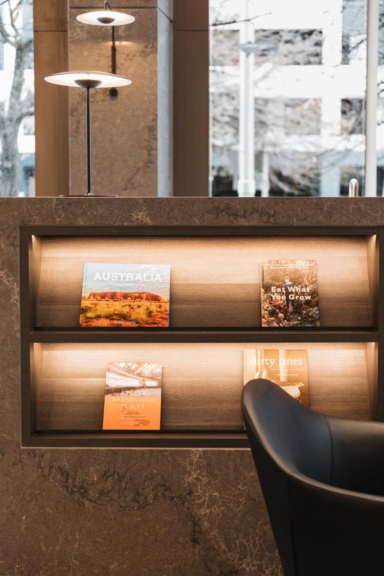 Meriton Suites Canberra Bagian luar foto A selection of magazines at the lounge
